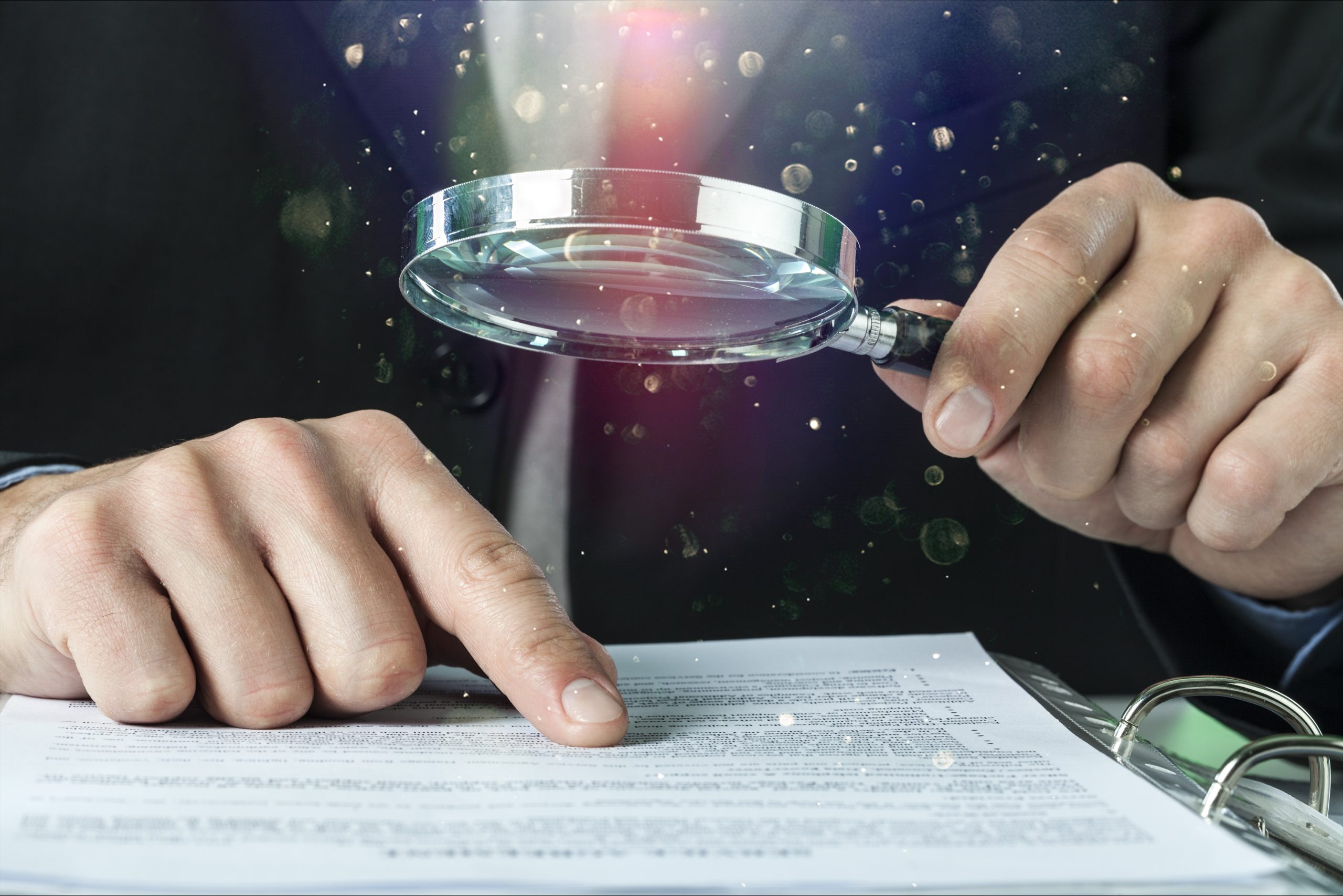 Business analytics and statistics concept, business man with Magnifying glass